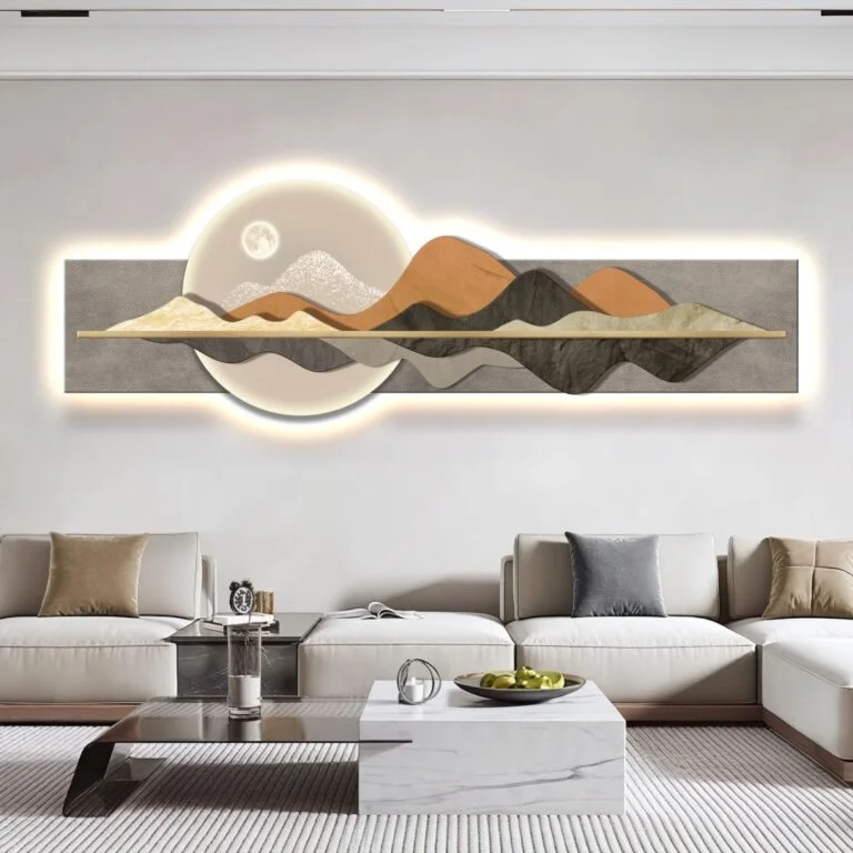 Modern illuminated wall art with mountain design in a luxury living room setting.