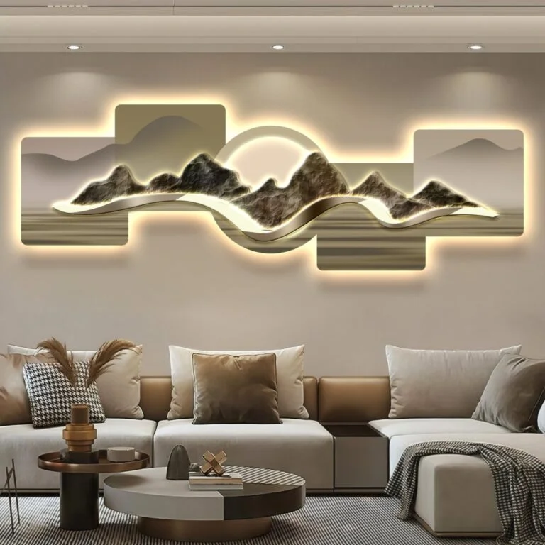 Modern illuminated wall art with mountain design in a luxury living room setting.