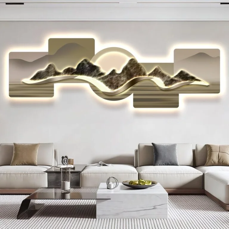 Modern illuminated wall art with abstract mountain design in a luxury living room setting.