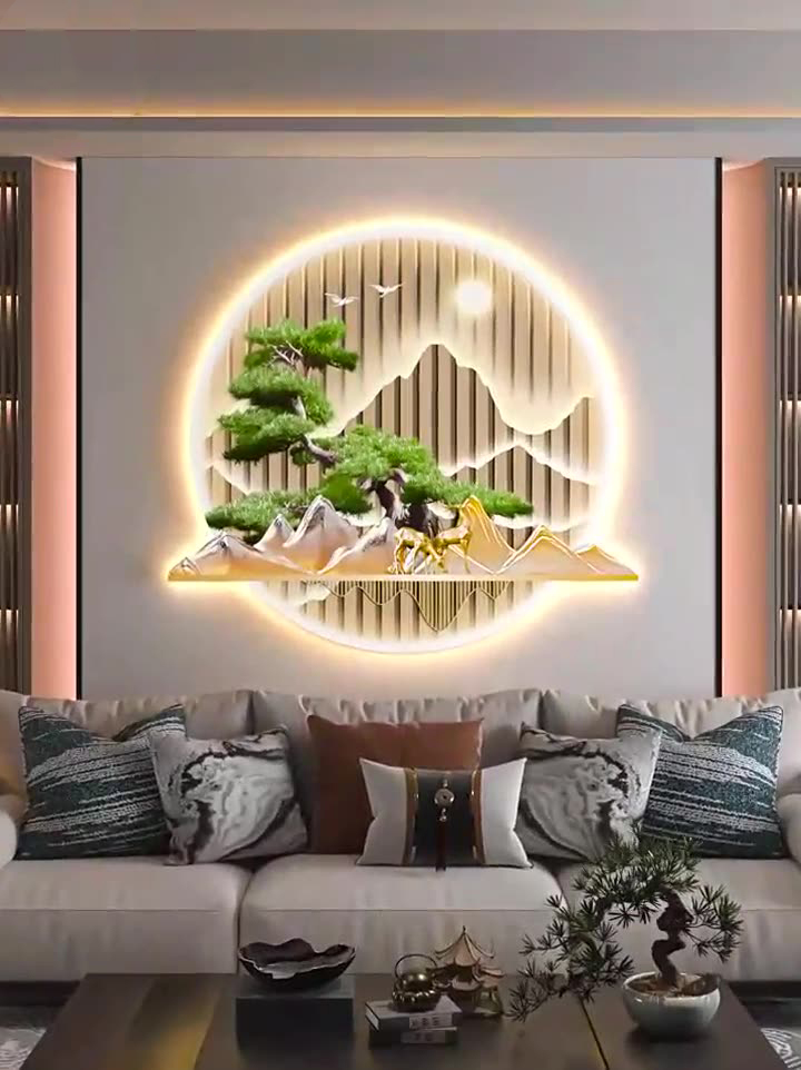 Illuminated modern wall art with nature scene above a sofa in a luxury living room.