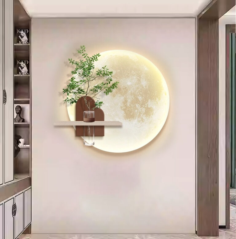 Illuminated round wall art with a plant and vase on a shelf, modern home decor.