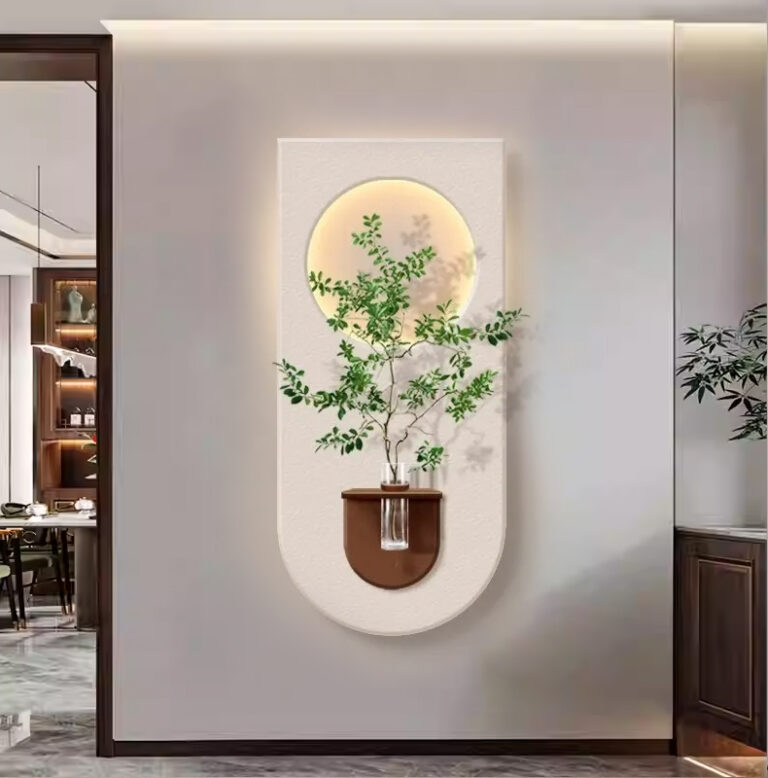Modern illuminated wall art with plant and circular design in luxury home decor setting.