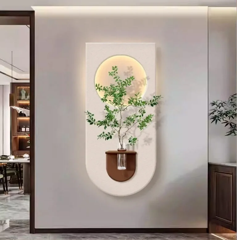 Modern illuminated wall art with plant and circular design in luxury home decor setting.
