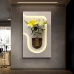 Illuminated wall art with flowers in a vase, modern home decor.