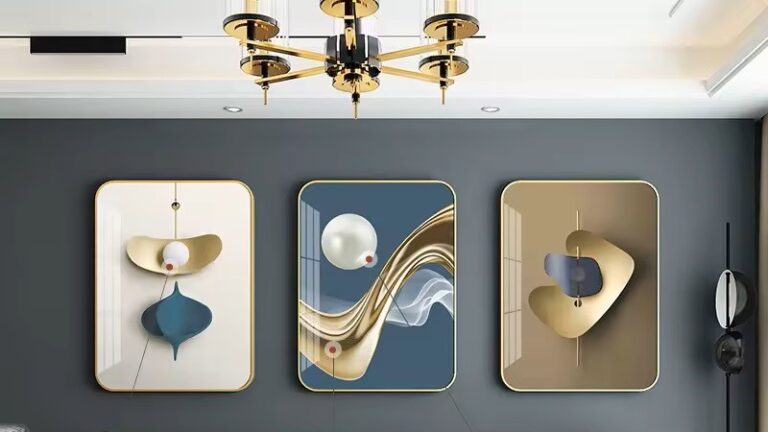 Modern luxury wall art with abstract designs in gold and blue tones, featuring three framed pieces.