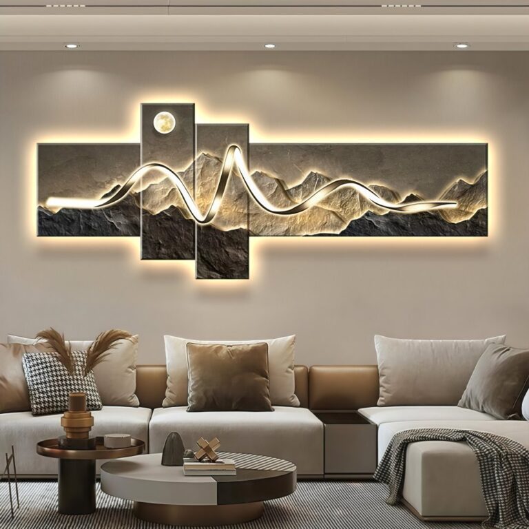 Modern illuminated wall art with mountain design in a luxury living room setting.