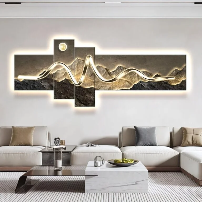Modern illuminated wall art with mountain design in a luxury living room setting.