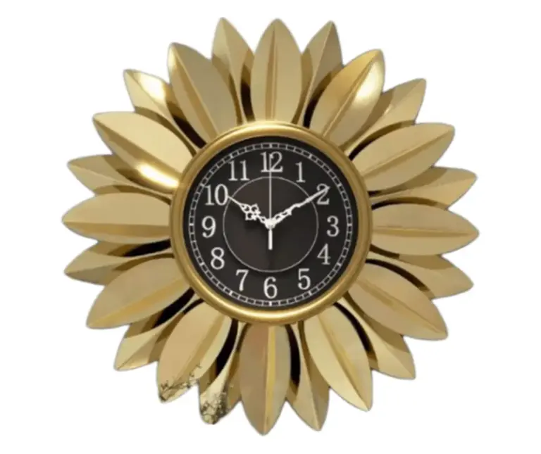 Gold decorative wall clock with a floral design, modern home decor accessory.