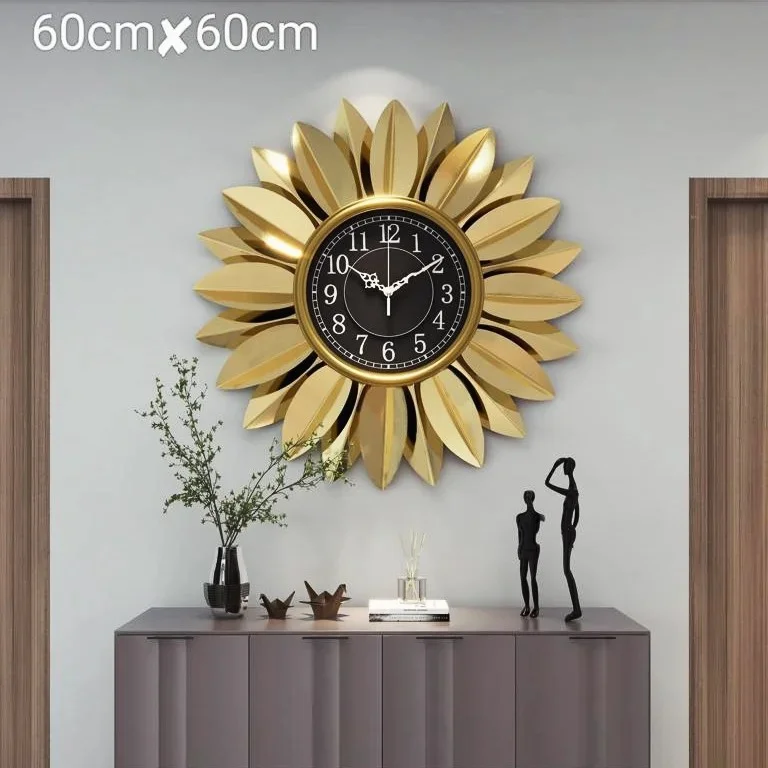Gold decorative wall clock with sunflower design in modern home decor setting.