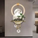 Modern illuminated wall art with moon and tree design, featuring LED lights and gold accents.