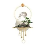 Modern decorative wall art with moon, bonsai tree, and gold accents.