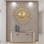 Luxury decorative wall clock with gold and blue accents in a modern home setting.