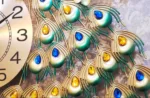 Modern decorative wall clock with peacock feather design and colorful gemstones.