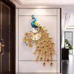 Luxury peacock wall clock with gold and blue accents in a modern hallway.