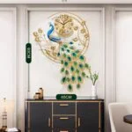 Luxury peacock wall clock with gold accents in a modern living room setting.
