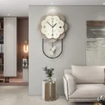 Modern luxury wall clock with unique design in a stylish living room setting.