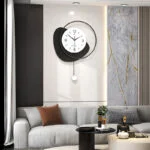 Modern luxury living room with a decorative wall clock and elegant decor.