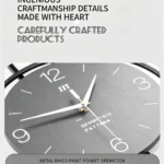 Modern wall clock with geometric pattern and metal baked paint finish.