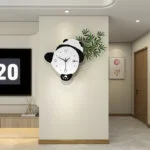 Modern panda-shaped wall clock in a stylish living room setting.