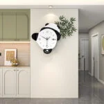 Modern decorative wall clock with panda design in a stylish home interior.