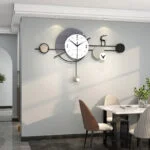 Modern wall clock with geometric design in a stylish dining room setting.