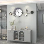 Modern decorative wall clock with abstract design in a stylish living room setting.