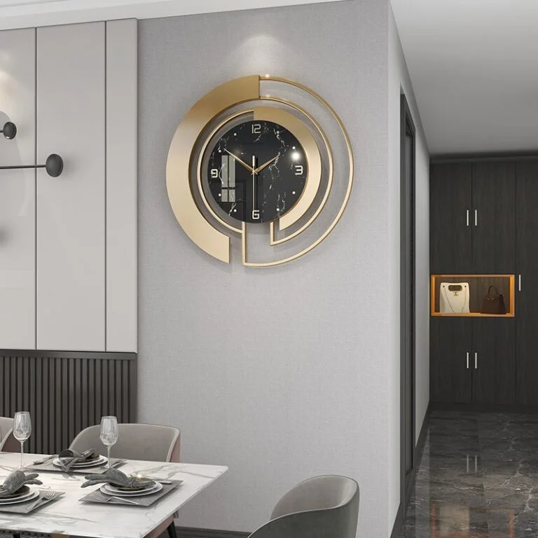 Modern luxury wall clock with gold accents in a stylish dining room setting.