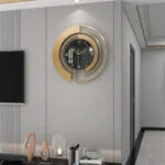 Modern luxury wall clock with gold accents in a stylish living room setting.
