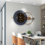 Modern luxury wall clock in dining room with elegant decor and table setting.