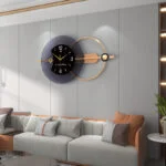 Modern luxury wall clock with gold accents in a stylish living room setting.