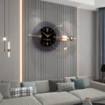 Modern luxury wall clock with gold accents in a stylish living room setting.