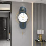 Modern luxury wall clock with gold accents in a stylish hallway setting.