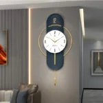 Modern luxury wall clock with gold accents in a stylish living room setting.
