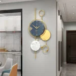 Modern luxury wall clock with gold accents in a contemporary home setting.
