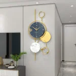 Modern luxury wall clock with gold accents in a stylish living room.
