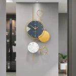 Modern luxury wall clock with gold accents in a stylish interior setting.