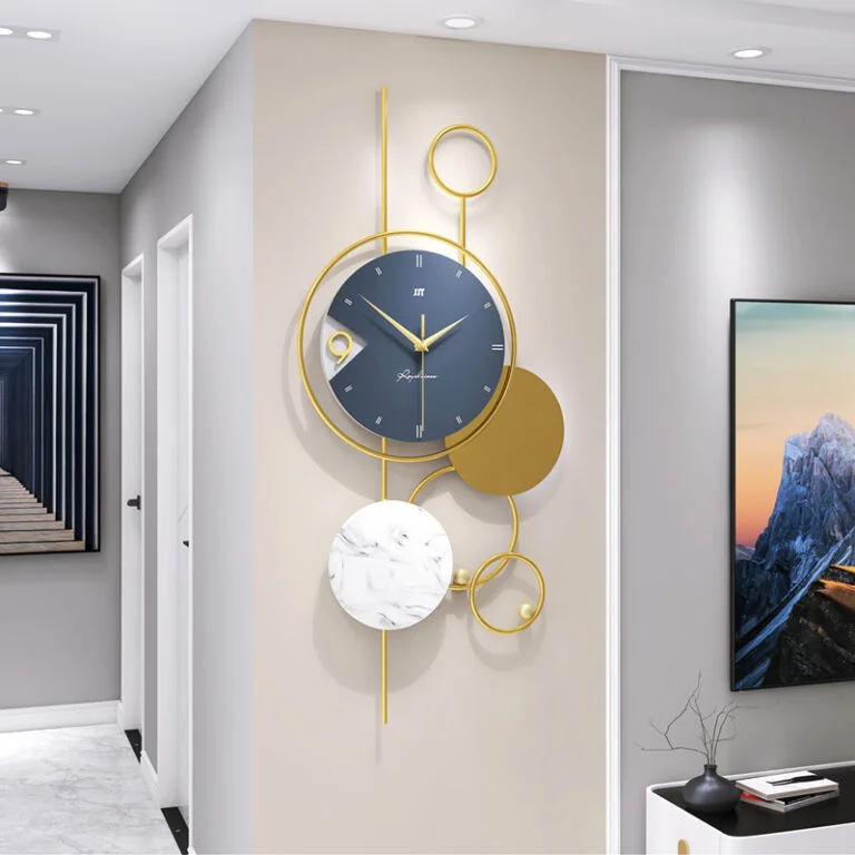 Modern luxury wall clock with gold accents in a stylish hallway.
