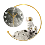 Modern decorative wall clock with astronaut design and moon theme.