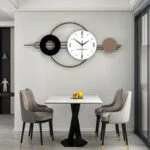 Modern dining area with a decorative wall clock and elegant chairs.