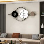 Modern decorative wall clock with geometric design in a luxury living room setting.