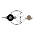 Modern decorative wall clock with geometric design and neutral colors.