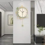Modern luxury wall clock with gold accents in a stylish interior setting.