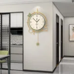 Modern luxury wall clock with gold accents in a contemporary home interior.