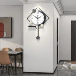 Modern wall clock with geometric design in a contemporary dining room setting.