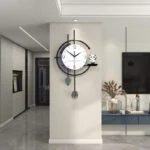 Modern luxury wall clock in a stylish living room with decorative accessories.