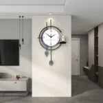 Modern wall clock with decorative shelf in a stylish living room.