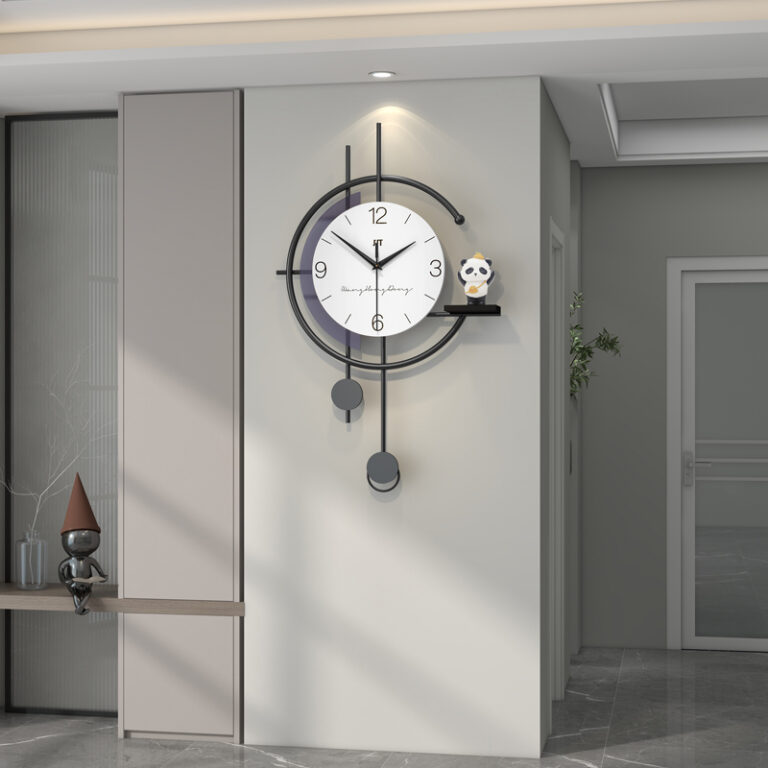 Modern luxury wall clock with pendulum in a stylish hallway setting.