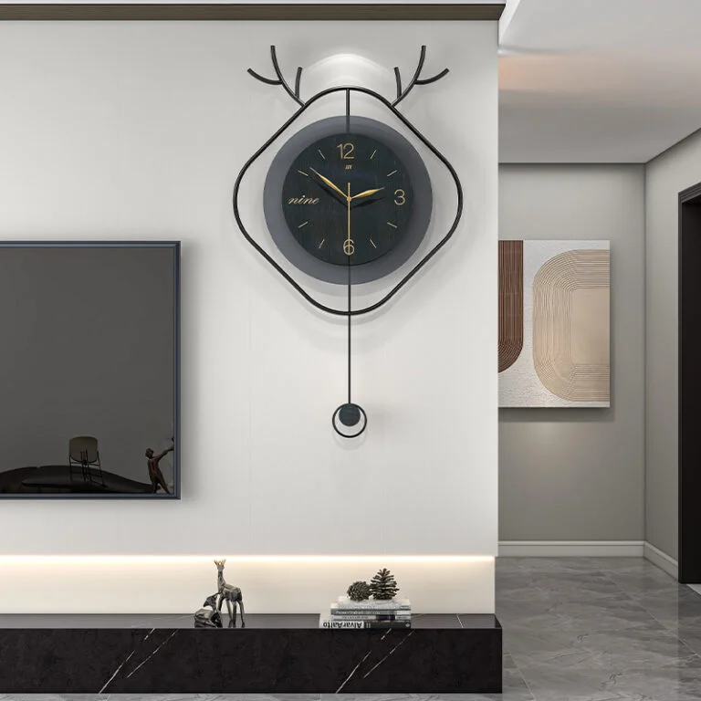 Modern luxury wall clock with antler design in a stylish living room setting.