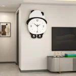 Modern panda-shaped wall clock in a stylish living room setting.