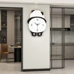 Modern panda-shaped wall clock in a luxury home interior.